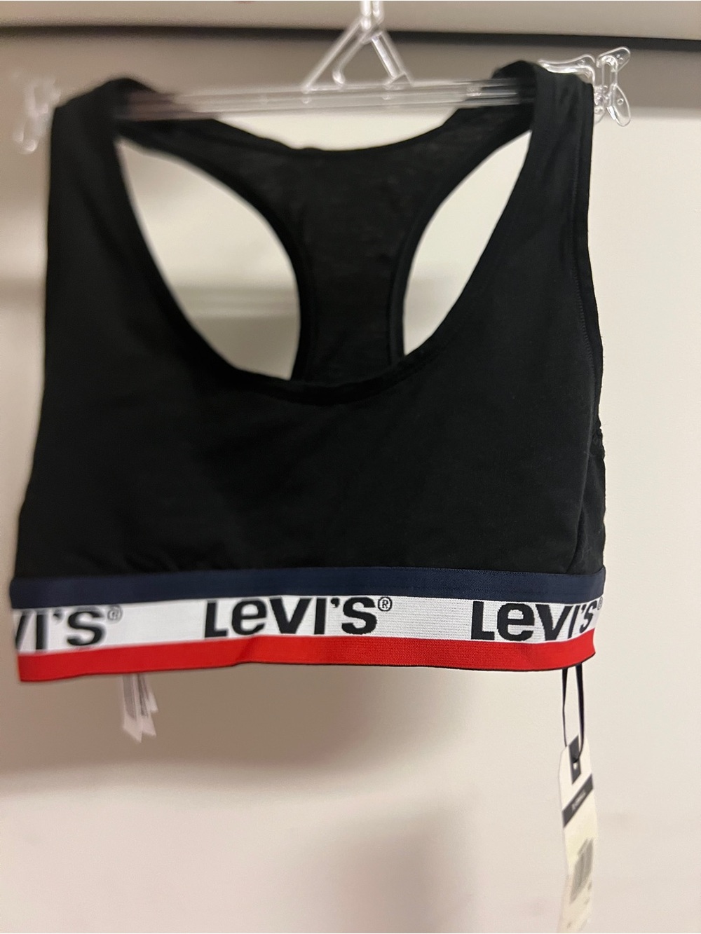 Size XS Levi's Black Racerback Sports Bra with Red & Navy elastic logo band.